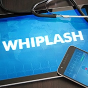 phone, tablet that reads ‘whiplash’ and stethoscope
