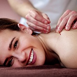 happy, smiling patient getting dry needling