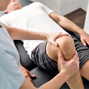 patient receiving knee exam