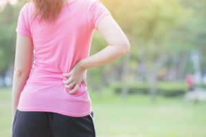 woman wondering how long back pain lasts after a car accident