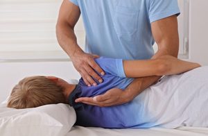 teenager being treated by the chiropractor